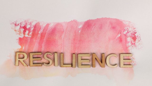resilience text on pink ink